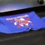 A blue custom printed t-shirt.