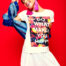 model posing in t shirt made with dtg printing method against a vibrant red background