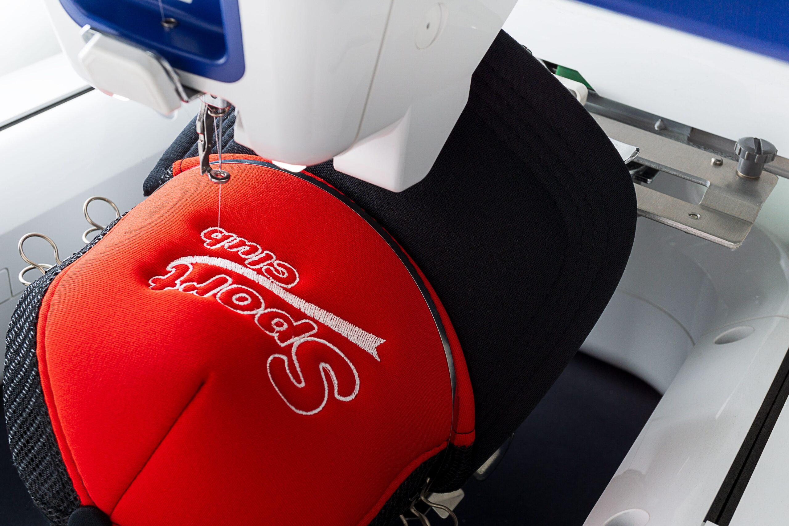 custom hat being embroidered for a business in austin tx by the logo store