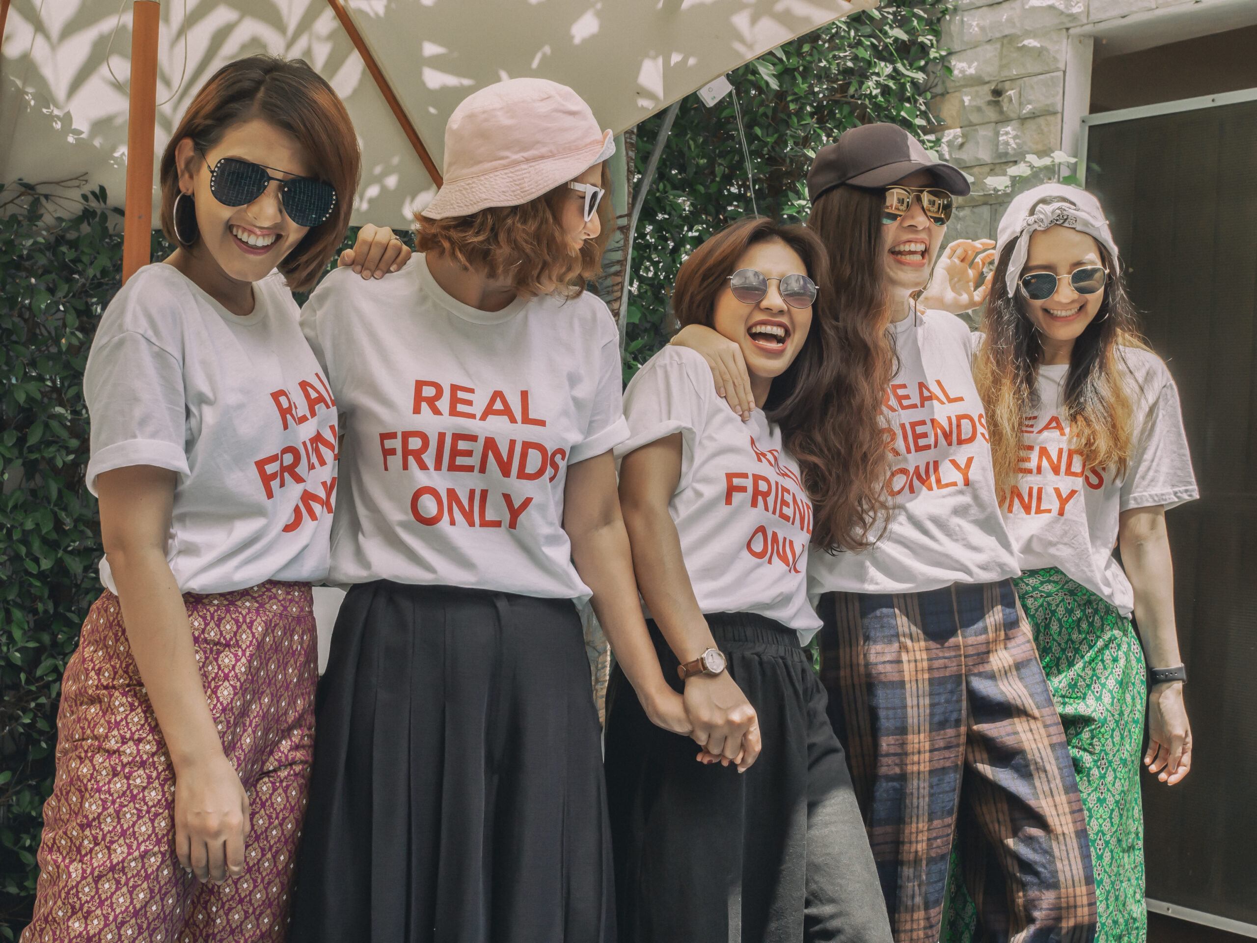friends at a birthday party wearing custom t shirts printed in austin tx
