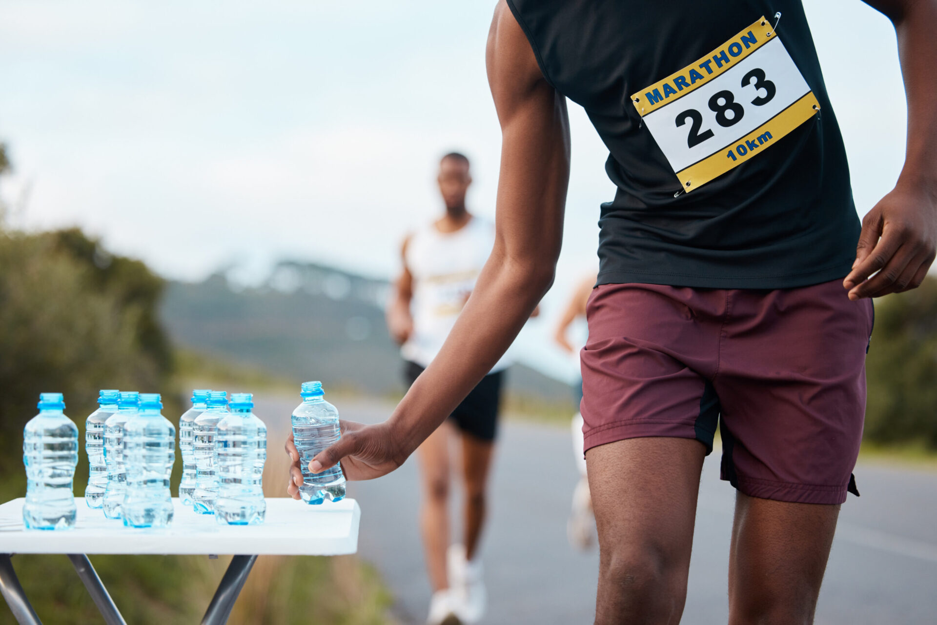 marathon runner at giveaway in austin tx choosing a water bottle