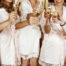 bride and bridesmaids touching glasses of champagne in austin tx wondering what a good gift for under 10 dollars